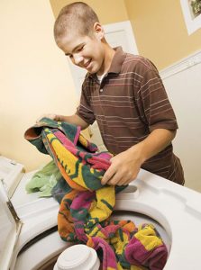 Kid doing laundry